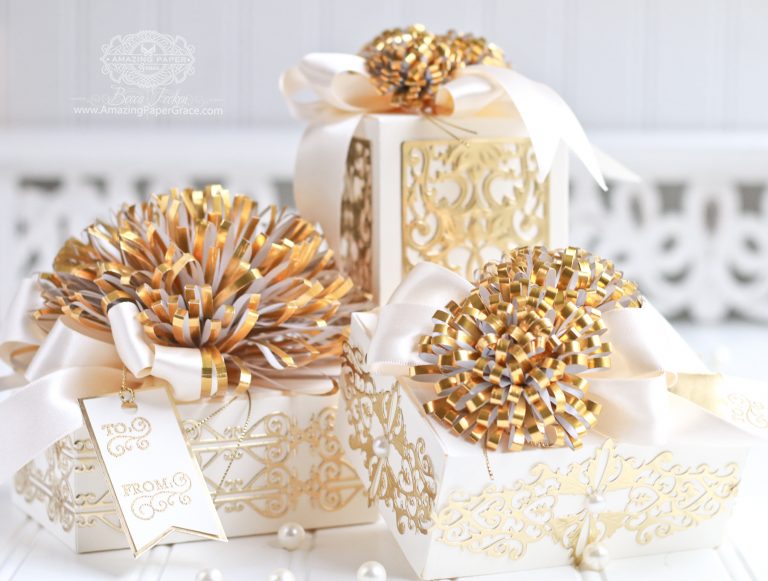 Luxe Gifts with Easy to Make Pom Pom Embellishment by Becca Feeken for Spellbinders using S4-049 Loopy Roll Flowers, S6-124 Mini Card/Booklet Gift Box, SR-106 Giving Makes You Happy - Gift Box, S4-768 Swirls Strip Die, S4-767 Classic Twirling Vines,  and S4-644 Botanical Box Inserts #spellbinders #diecutting #gifts