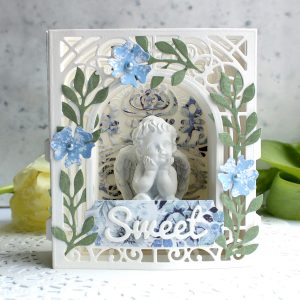 Video Friday | Paper Diorama / Figurine Holder with Olga using S3-303 Little Plants, S4-563 Phrase Set One, S4-883 Nordic Tree, S5-338 Wreath Elements, S6-138 Grand Arch 3D Card, SES-013 Flourish Stitch #spellbinders #diecutting