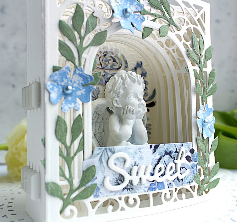 Video Friday | Paper Diorama / Figurine Holder with Olga using S3-303 Little Plants, S4-563 Phrase Set One, S4-883 Nordic Tree, S5-338 Wreath Elements, S6-138 Grand Arch 3D Card, SES-013 Flourish Stitch #spellbinders #diecutting 