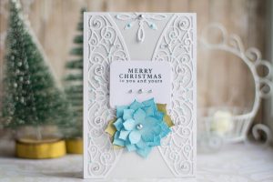 Spellbinders A Charming Christmas Collection by Becca Feeken - Inspiration | Merry Christmas Card with Elena Salo featuring S4-963 Snowflake Toppers, S5-379 Yuletide Snowflakes, S5-384 Charming Tag Pocket, S4-960 Cinch and Go Poinsettia #spellbinders #neverstopmaking #amazingpapergrace