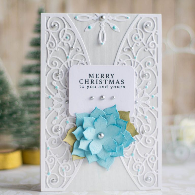 Spellbinders A Charming Christmas Collection by Becca Feeken - Inspiration | Merry Christmas Card with Elena Salo featuring S4-963 Snowflake Toppers, S5-379 Yuletide Snowflakes, S5-384 Charming Tag Pocket, S4-960 Cinch and Go Poinsettia #spellbinders #neverstopmaking #amazingpapergrace