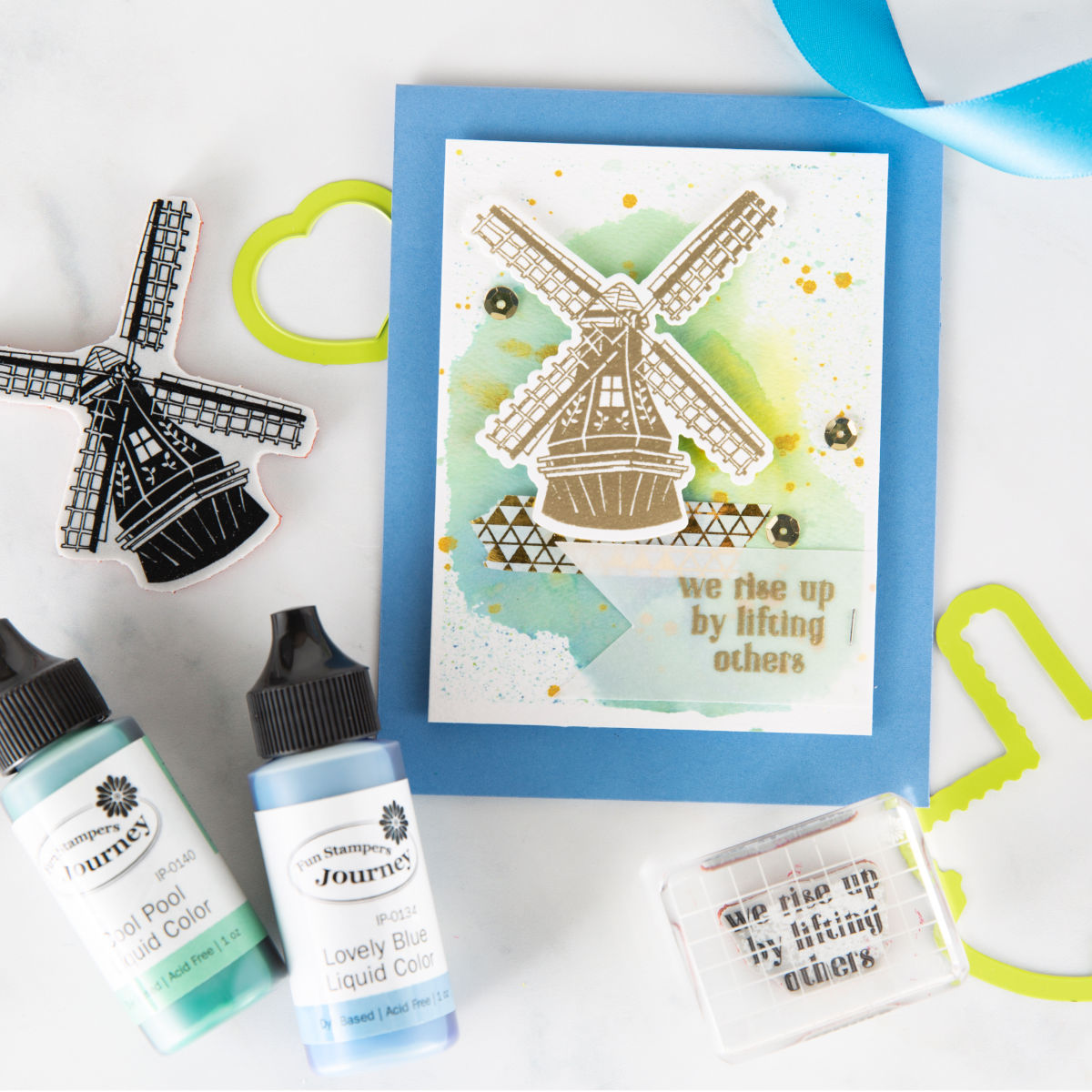We Rise By Lifting Others, handmade card idea with Fun Stampers Journey March Stamp of the Month, Good Places. Embossed gold windmill and watercolor background are elegant for an encouragement card. 