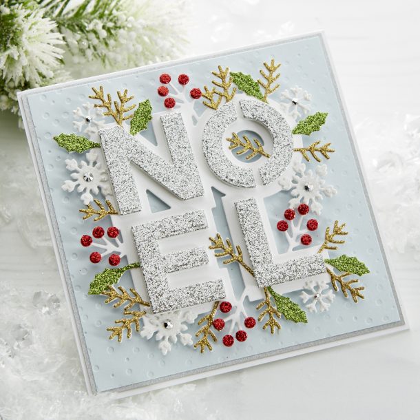 S4-1062 Festive Noel: Get in the holiday spirit with this layered Noel die set. A gorgeous mix of holiday foliage and snowflakes, you (almost) won’t want to share this card when it’s finished! What’s New | Spellbinders Sparkling Christmas Collection #Spellbinders #NeverStopMaking #DieCutting #Cardmaking #GlimmerHotFoilSystem #Christmas